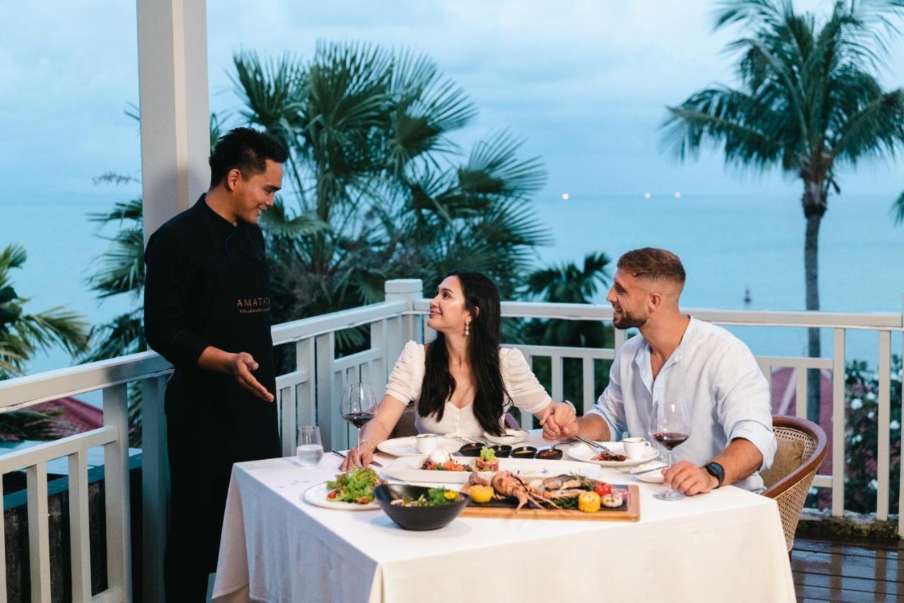 Amatara Welleisure Resort Cape Panwa Bagian luar foto A butler serving guests at a resort